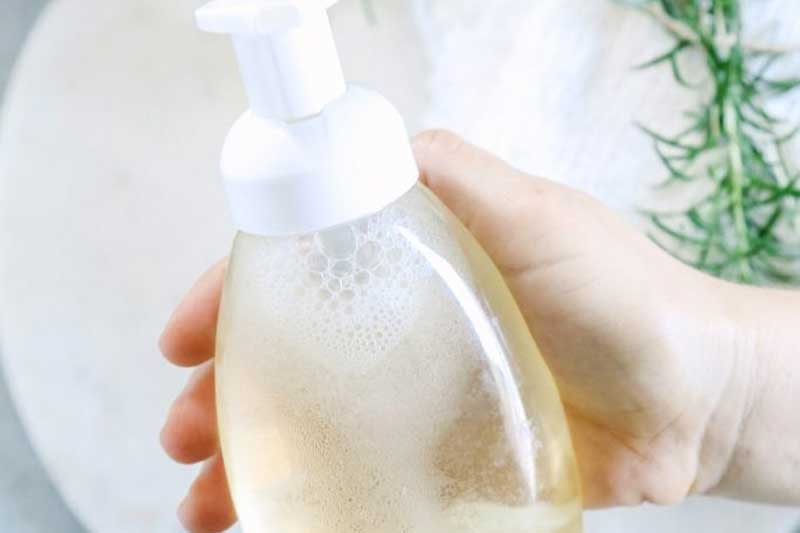 close-up of clear soap dispenser will wth foaming wash