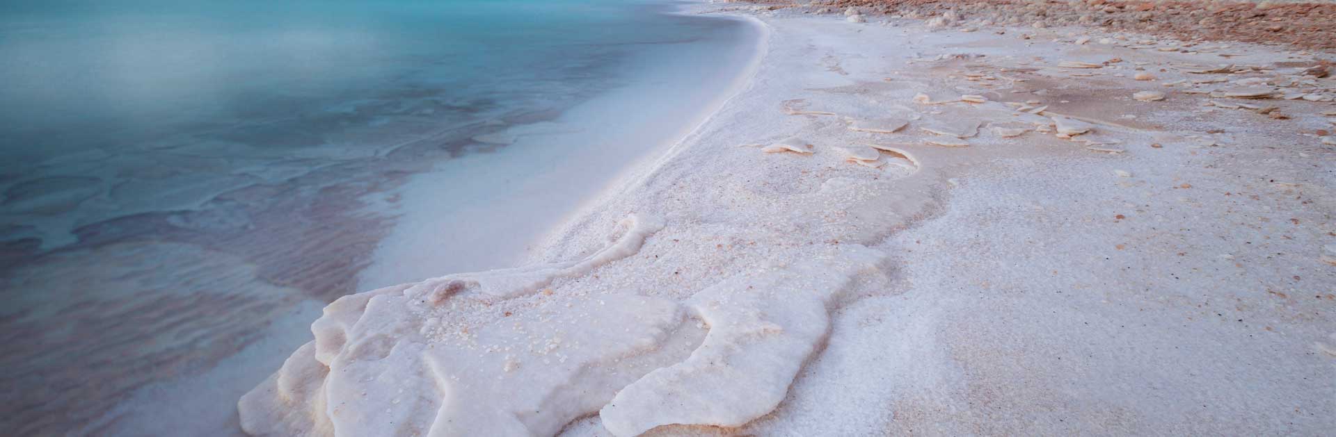 sea shore with natural salt deposits on the sand